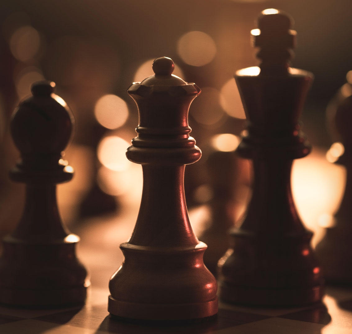 wooden-chess-pieces-on-the-chessboard-and-dim-lighSqare